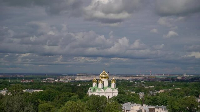 Orthodox white church building with golden dome outdoors. Christianity religion. Cathedral or temple in Pushkin city, Saint-Petersburg in Russia. Aerial summer day.