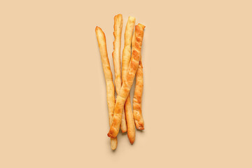 Tasty Italian Grissini on yellow background