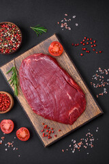 Fresh raw beef with salt, spices and herbs