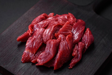 Fresh raw beef with salt, spices and herbs