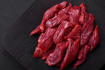 Fototapeta premium Fresh raw beef with salt, spices and herbs