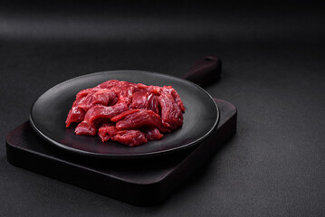 Fresh raw beef with salt, spices and herbs