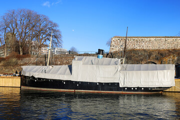 Fototapeta premium Touristic scenic view of the Oslo harbour near the Akershus Fortressand the city in the dusk , Norway, Europe