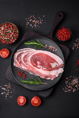 Fresh raw bacon sliced with spices and herbs