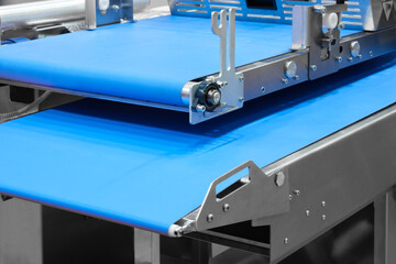Conveyor Belt Food.Factory for the production of food. Production line with packaging. Food products  in plastic packaging on the conveyor. food production concept