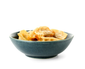 Bowl with tasty Chinese jiaozi and sesame on white background
