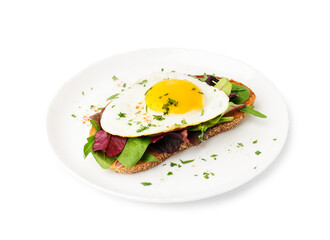 Delicious sandwich with fried egg and greens on white background