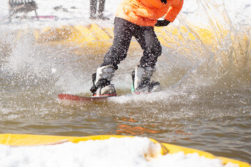 Snowboarder on a snowboard.Snowboarding down the mountain with overcoming .