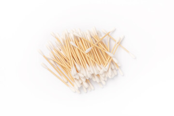 Cotton swabs isolated on white background. Bamboo cotton buds. Means for hygiene of ears. Eco friendly materials.