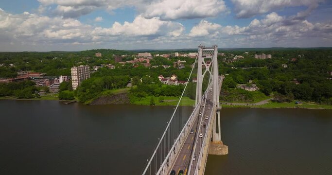Aerial of traffic on Mid Hudson Bridge over Hudson River in Poughkeepsie New York on Bright Sunny Summer Day