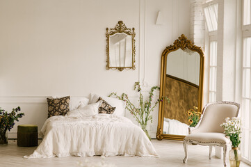 Large white bedroom with large windows, beautiful bright interior