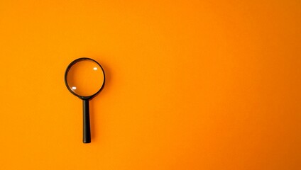 Magnifying glass, magnifier in a black frame on an orange background.  Research concept,...