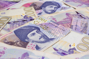 Background with purple paper bills 100 GEL. One hundred Georgian lari. Money of Georgia. Portrait...