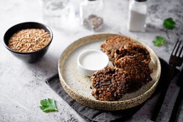 Buckwheat mushroom fritters in a plate with sauce