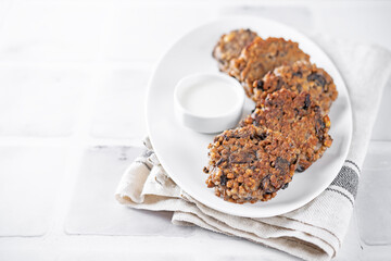 Buckwheat mushroom fritters in a plate with sauce