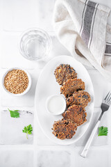 Buckwheat mushroom fritters in a plate with sauce