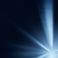 Ray light effects on black background for overlay design. Rays of light fall on empty space. Copy space. Blue beams.