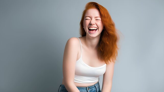 Portrait of a fictional ginger female model wearing a white tank top, laughing candidly, isolated. Generative AI illustration.