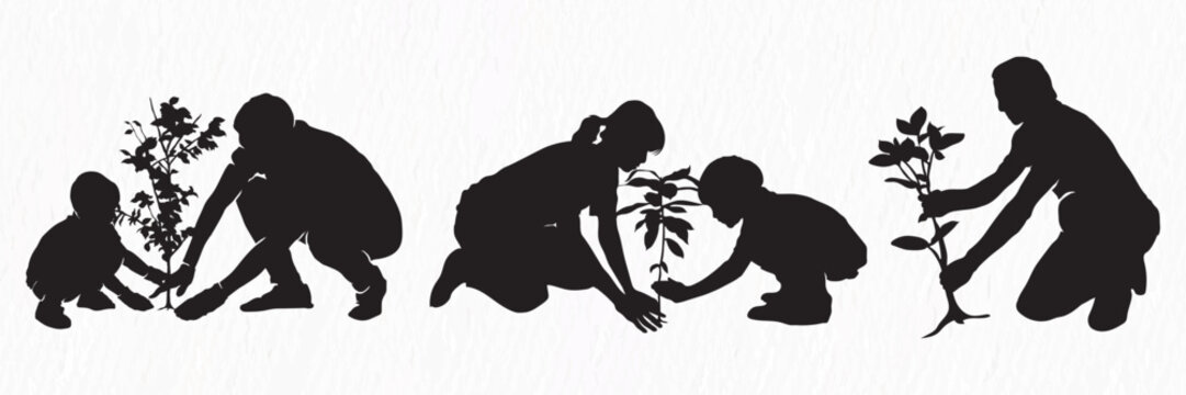 A silhouette of a family planting a tree