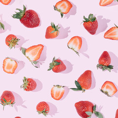 Summer fruit pattern made of fresh strawberries on a pink background. Juicy aesthetic wallpaper.