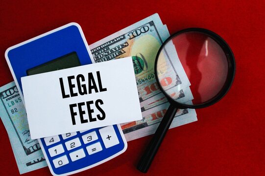 Calculator, Magnifying Glass And Paper Money With The Word Legal Fees. Fee Concept