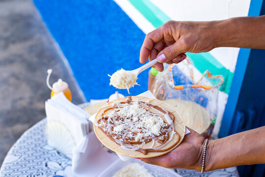 Traditional Colombian dessert - Wafers with fruit, cheese and caramel sauce