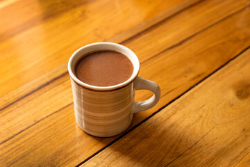 Cup of hot chocolate with cinnamon - Traditional Colombian drink
