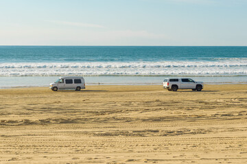 Oceano, California, USA -December 14,  2022.  Cars on the beach. Oceano Dunes, California Central Coast, the only California State Park that allows  vehicles to drive on the beach