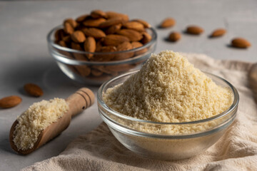 Almond flour and almonds in bowls. Gluten free food concept.