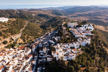 Aerial view of Casares cityscape with ancient buildings located on hilltop, Andalusia, Spain