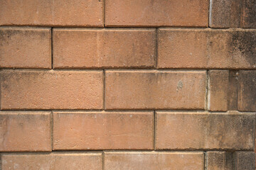 Brown block brick wall background, building wall