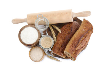 Freshly baked bread, sourdough and other ingredients on white background, top view