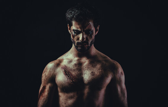 Portrait of a shirtless man after a fight