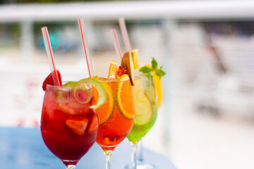 Refreshing cocktails with an abundance of fruits on a summer day