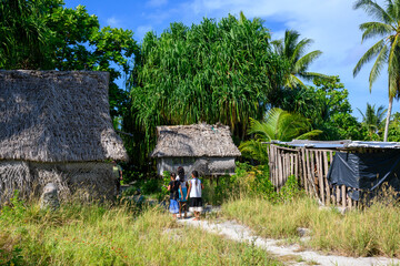 Children walking home from school Fanning Island in South Pacific