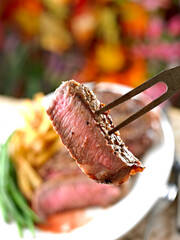 Slice of New York Steak on a fork