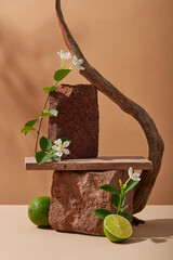 Blocks of stone are stacked with a rectangle podium, arranged with flowers, tree branch and a half...