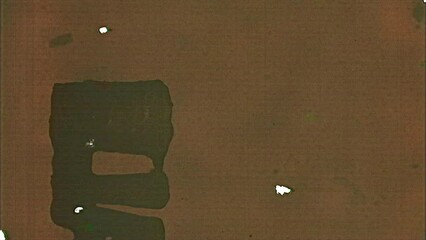 Picture Start 0615: Film leader with writing, dust and scratches (Loop).