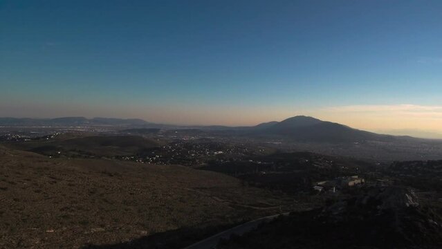 Epic drone shot view of mount Himittos in Athens Greece during sunset
