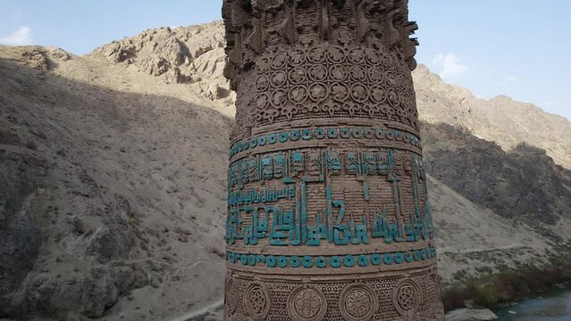 Rising close-up aerial of text and symbols on ancient Minaret of Jam
