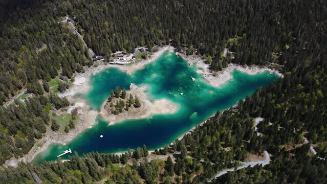 4K Aerial of the turquoise lake Caumasee in Switzerland, Flims