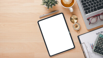 Office desk workplace with blank screen tablet, laptop computer, eyeglass, calculator and cup of coffee, Top view flat lay with copy space.