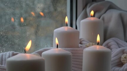 Home fragnance concept autumn holidays at cozy home on the windowsill Hygge aesthetic atmosphere on knitted white sweater. Still life of micro moment candid slow living. Mental health wellbeing