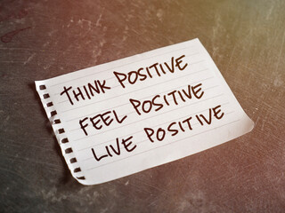 Think feel live positive, text words typography written on paper, life and business motivational inspirational