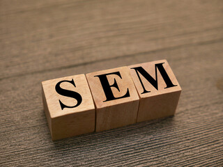 SEM Search engine marketing, text words typography written with wooden letter, life and business...