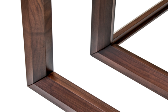 Wooden frame of bedside table made of solid walnut isolated on white background. Joinery angular joint of planks on dowels closeup