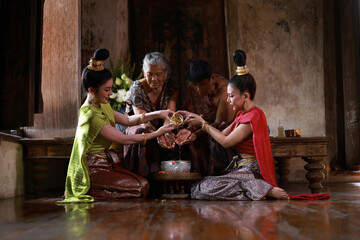 Songkran festival. The tradition of bathing the Buddha and elder With respect to faith.