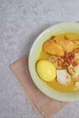 Opor Ayam (Chicken Curry) and Ketupat Lebaran (Rice Cake). Special Eid celebratory dish from Indonesia and Malaysia.