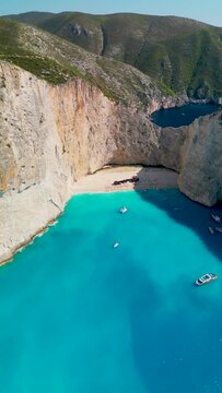 Aerial view Drone Shoot of Wreck Ship on the Beach with Cliff at a Greece Island