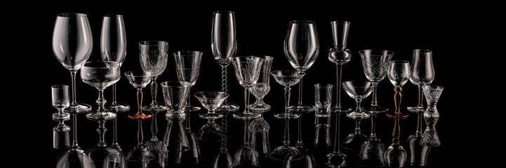 The world of glasses for wine, champagne and all kinds of spirits as a panoramic image.